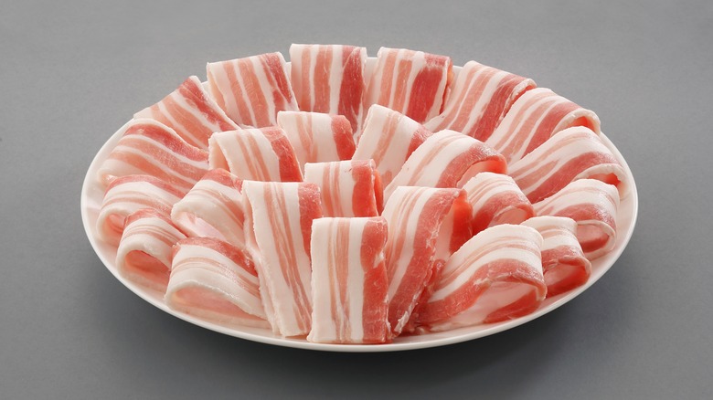 Uncooked pork belly slices