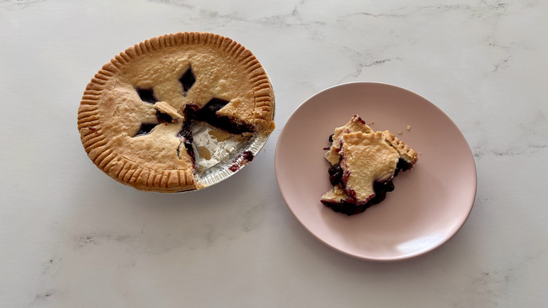 A blueberry pie sitting on a counter.