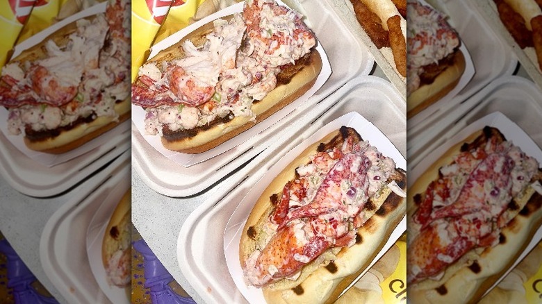 two cold lobster rolls in styrofoam 