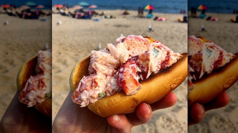 lobster roll with beach in foreground