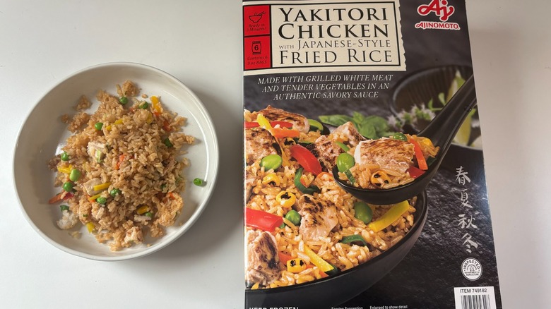 bowl of ajinomoto yakitori chicken and fried rice next to box on table