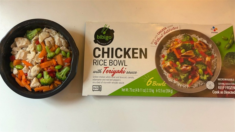 bibigo chicken rice bowl next to box on table