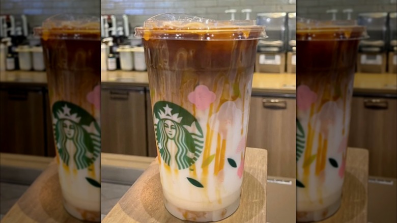 Caramel hazelnut mocha on wooden table in store