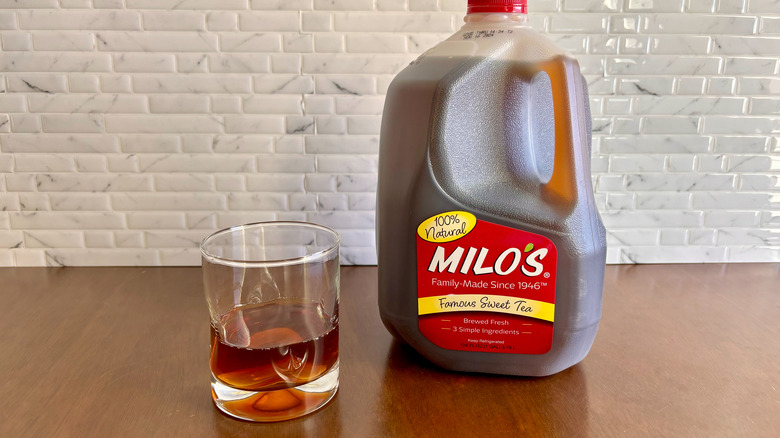 Glass of sweet tea next to Milo's sweet tea gallon