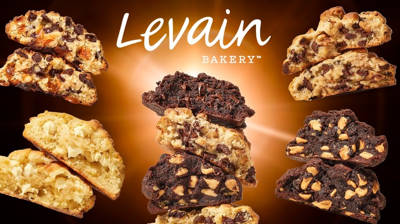 Several Levain cookies underneath the chain's logo and against a brown background