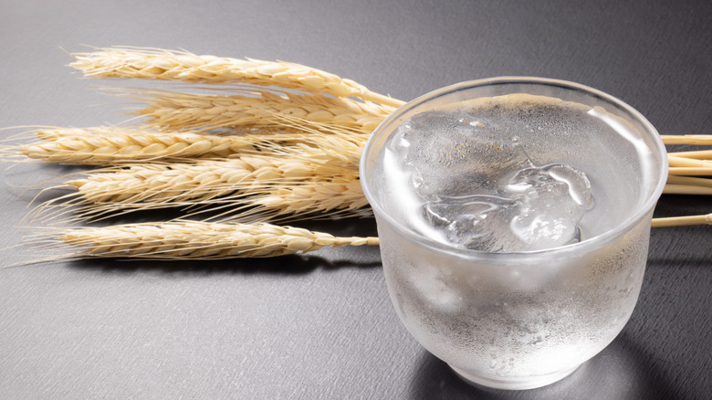 Glass of shochu with barley stalks