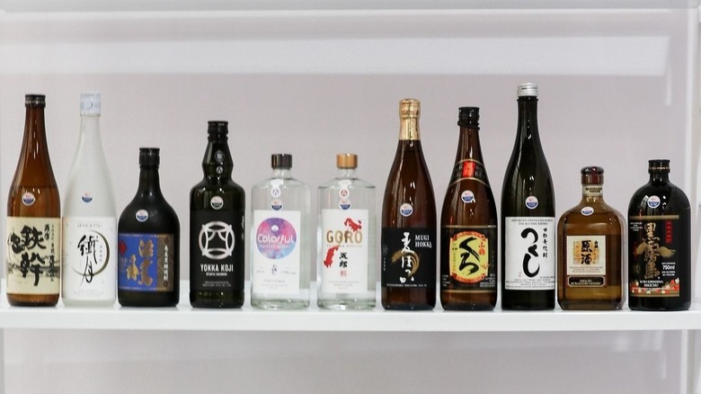 bottles of shochu on a shelf