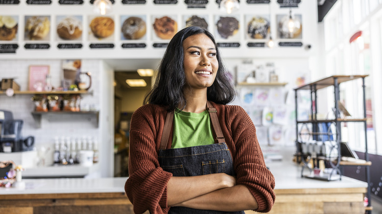 woman at coffee roaster counter