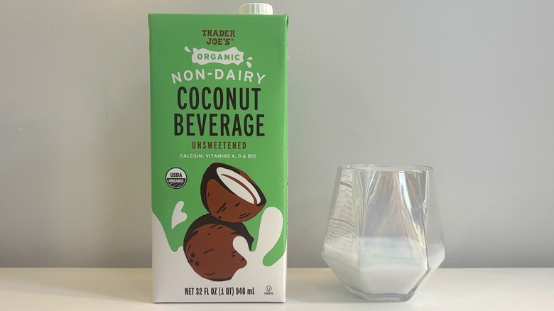 Box and glass of Trader Joe's Organic Non-Dairy Coconut Beverage on white background