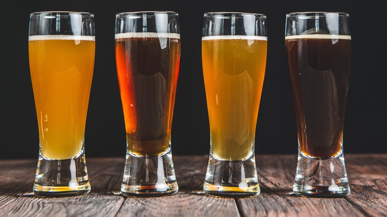 Four glasses of various beers