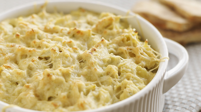 skillet of chessy artichoke dip