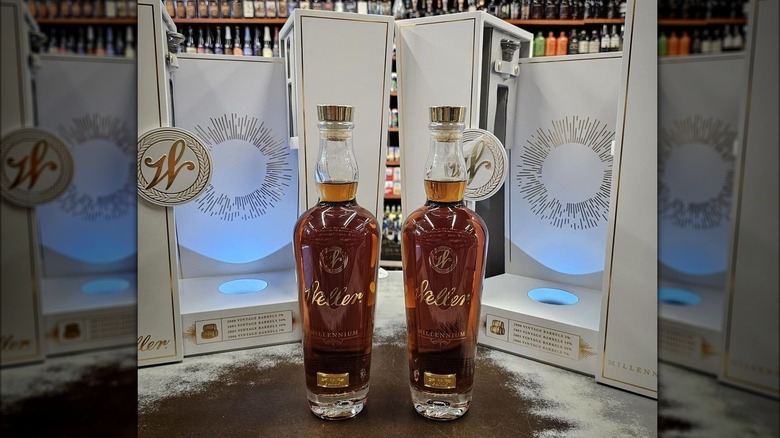 Two bottles of Weller Millennium bourbon with packaging