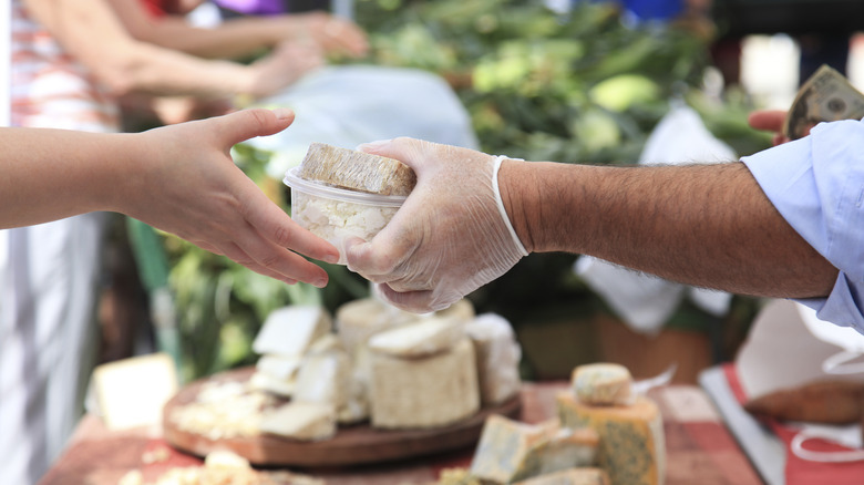 buying cheese at market