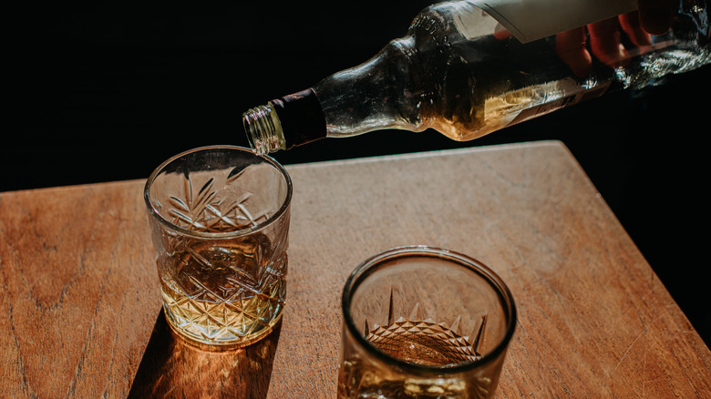 pouring bourbon from bottle