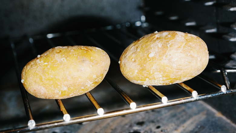 Potatoes cooking on oven rack