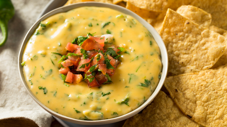 Queso with tomatoes and tortilla chips