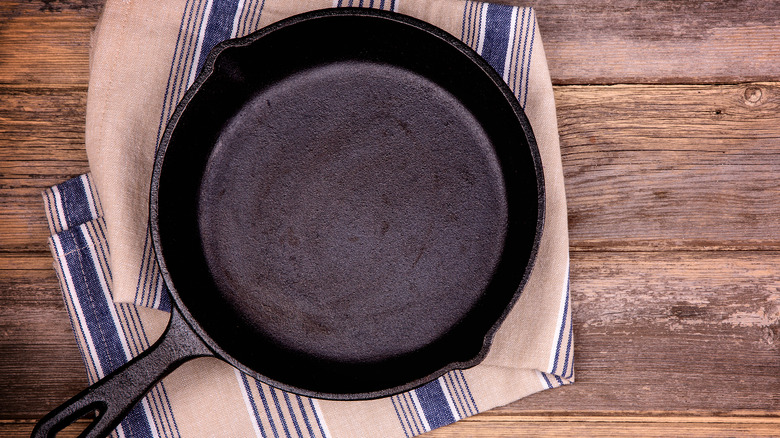 cast iron skillet on a towel