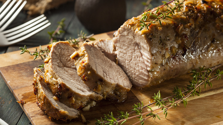 Pork tenderloin on wooden board