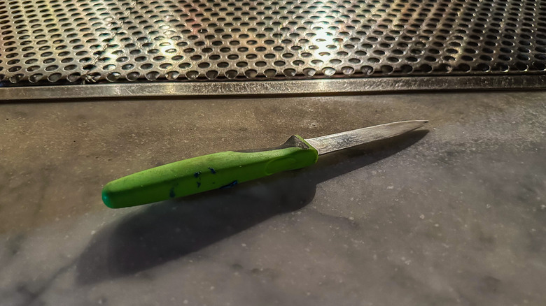 paring knife sitting on a bar