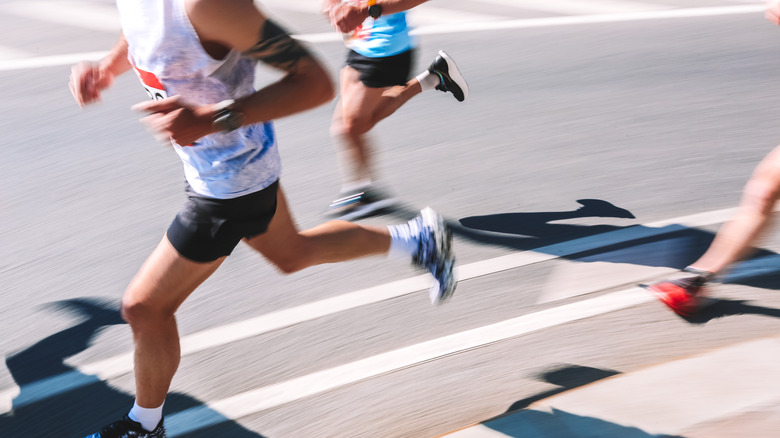 Running with feet on pavement