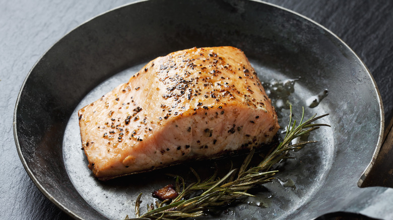 cooked salmon fillet  in a skillet