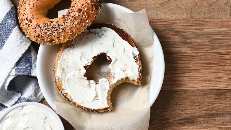 bagels spread with cream cheese