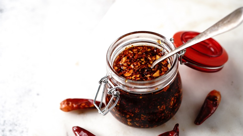 Chili oil in jar on counter 