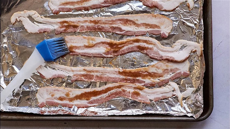 brushing bacon with hot honey