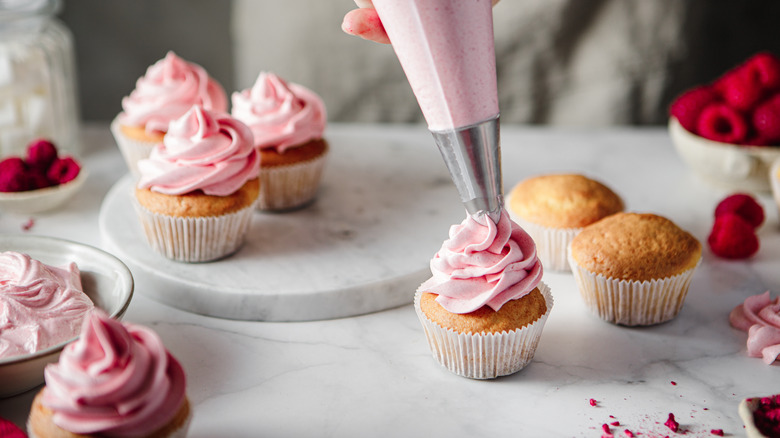 pink buttercream and cupcakes