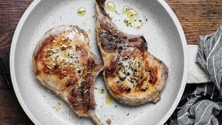 seasoned pork chops in a skillet