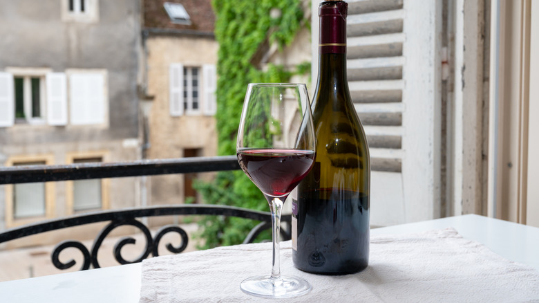 red wine on balcony table 