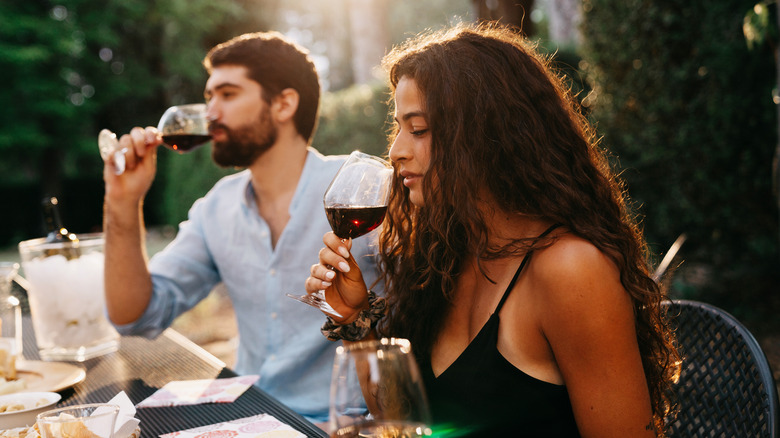 couple tasting red wine