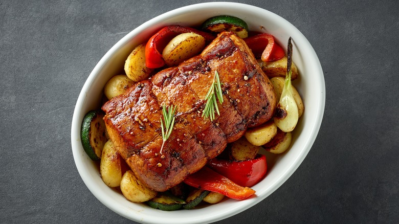 Tray of roasted pork tenderloin and vegetables