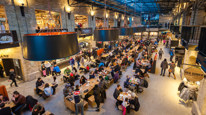 People dining inside food hall