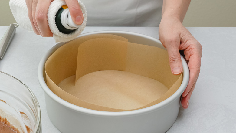 Spraying oil in a pan 