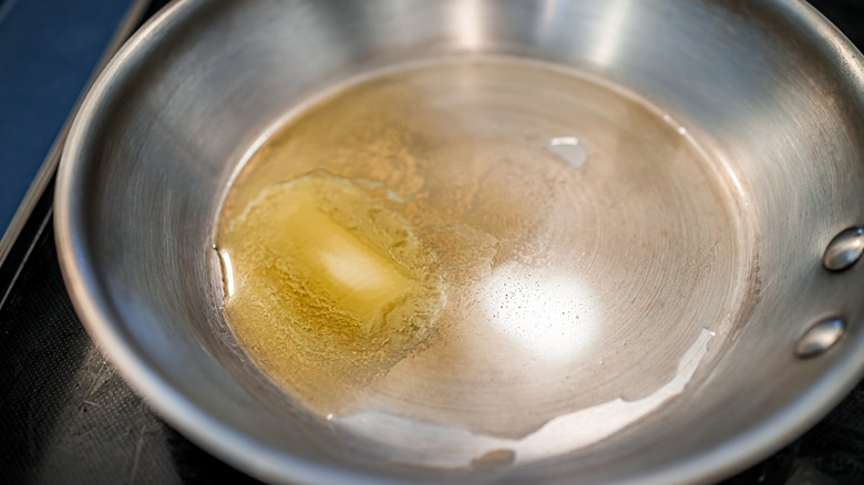 butter melting in skillet 