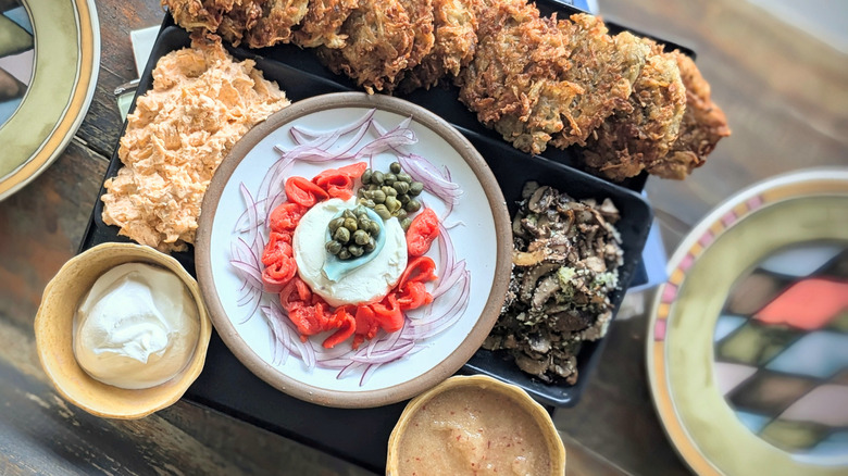 cream cheese, capers, onions, salmon, with latkes for toppings