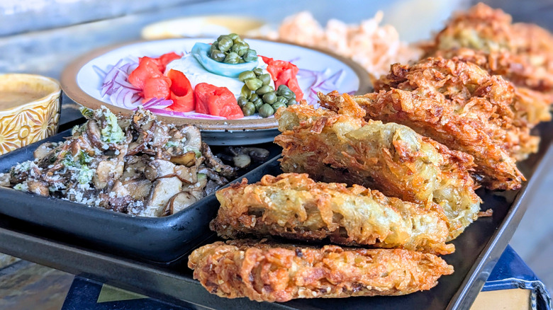 latkes with applesauce, sour cream, salmon, capers