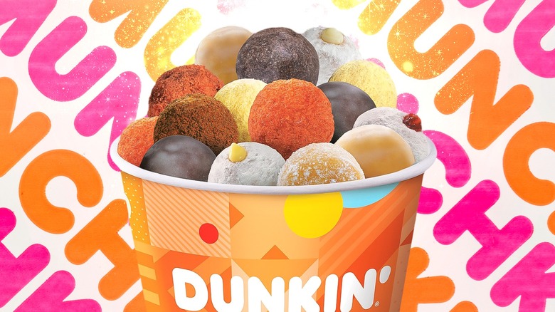 Barrel of Dunkin' Munchkins with logo background