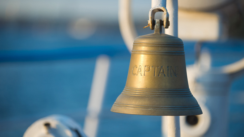 A ship's bell that says "captain"