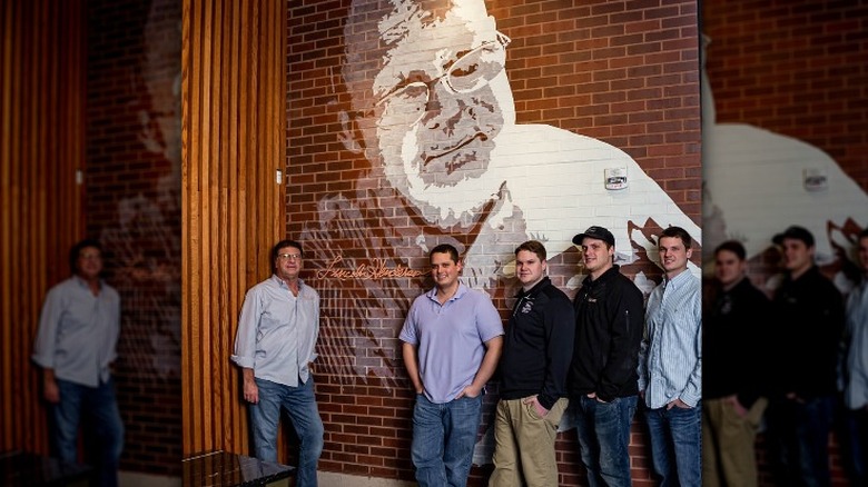 Henderson family and mural of Lincoln