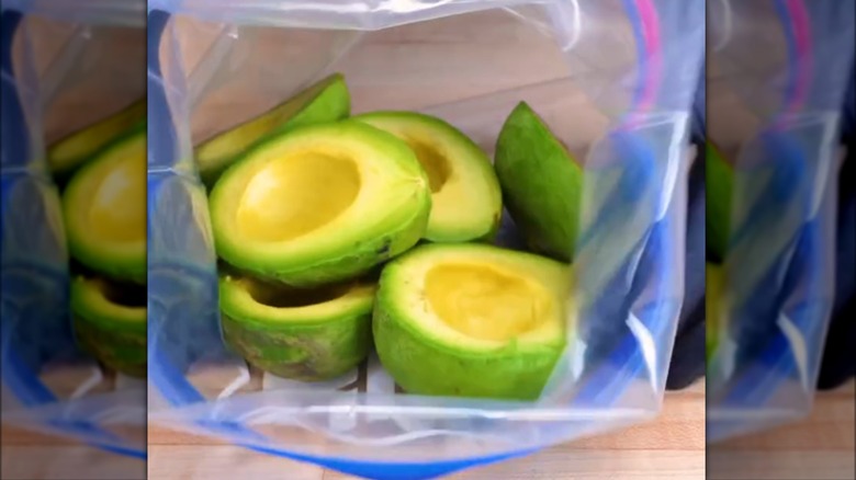 Halved avocados in a resealable plastic bag