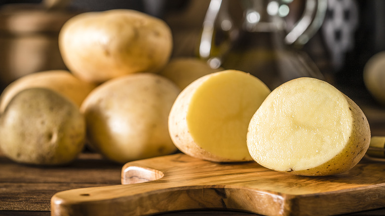 sliced potato and whole potatoes