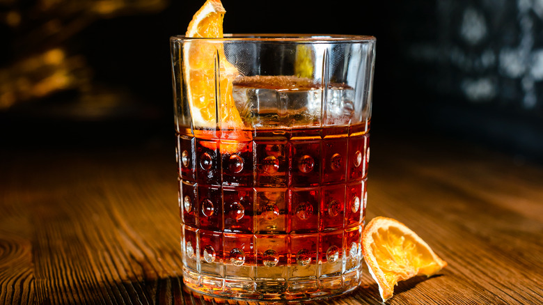 Glass of bourbon with slice of orange