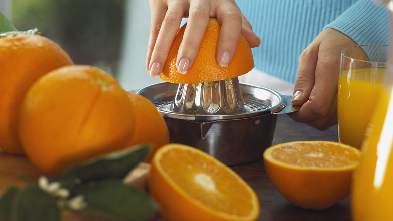 juicing fresh oranges