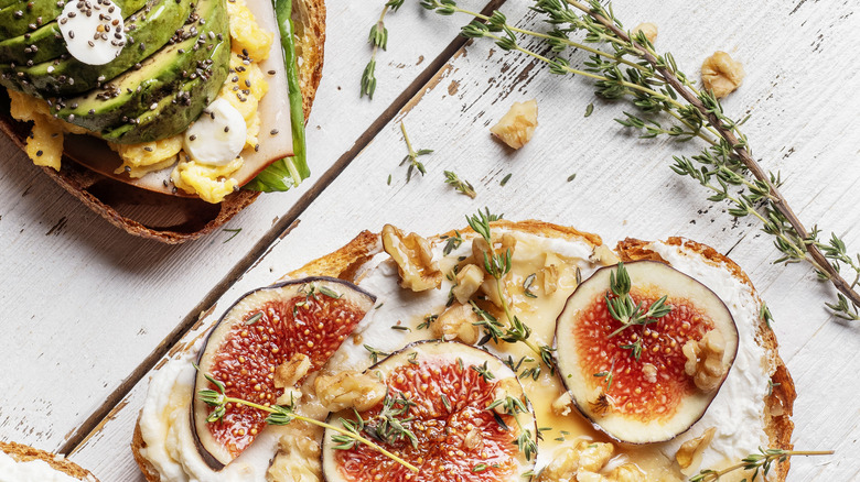 different fancy breakfast toasts on a wood table