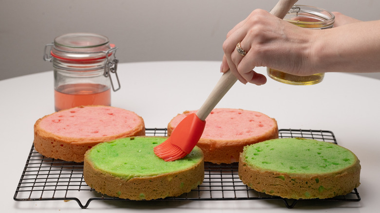 brushing sponge with cake soak