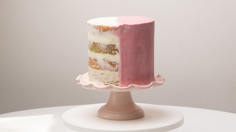 cake half iced in pink