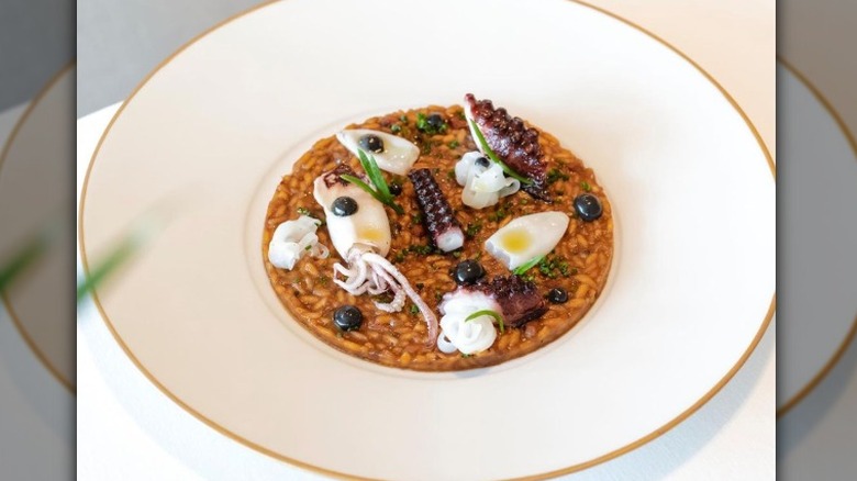 Rice with squid in white bowl