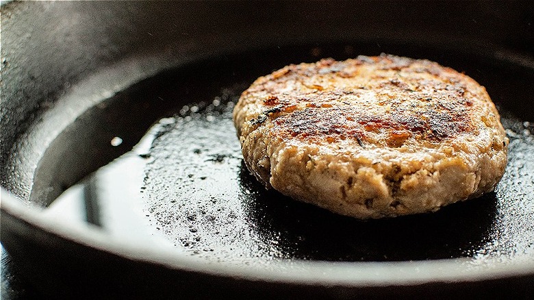 burger patty in skillet